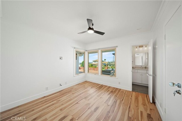 206 Calle De Sirenas, Redondo Beach, CA 90277 - unfurnished bedroom featuring light wood-style flooring, baseboards, a ceiling fan, crown molding, and connected bathroom