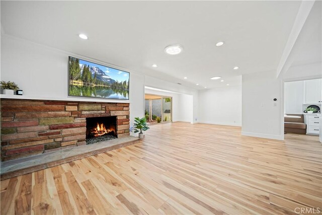 206 Calle De Sirenas, Redondo Beach, CA 90277 - unfurnished living room featuring a fireplace, light wood finished floors, recessed lighting, and baseboards