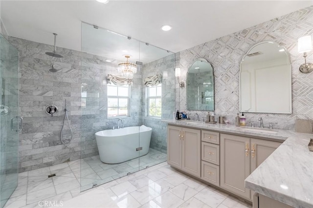 34072 Lily Rd, Yucaipa, CA 92399 - bathroom featuring a stall shower, tile walls, a freestanding bath, double vanity, and a chandelier