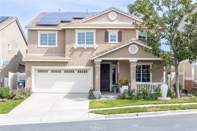 traditional-style home with a garage, stucco siding, a porch, and driveway