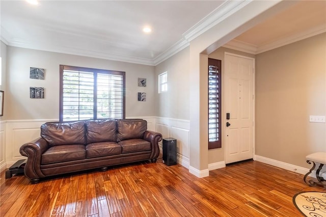 34072 Lily Rd, Yucaipa, CA 92399 - living room featuring hardwood / wood-style floors, wainscoting, crown molding, recessed lighting, and a decorative wall