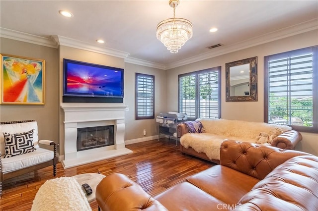 34072 Lily Rd, Yucaipa, CA 92399 - living room featuring wood finished floors, recessed lighting, crown molding, a chandelier, and a glass covered fireplace