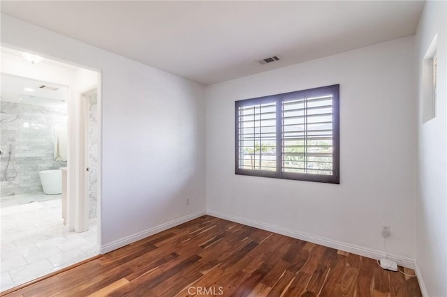 34072 Lily Rd, Yucaipa, CA 92399 - unfurnished room with wood finished floors and baseboards