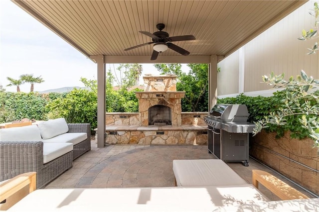 34072 Lily Rd, Yucaipa, CA 92399 - view of patio / terrace with grilling area, ceiling fan, and an outdoor living space with a fireplace