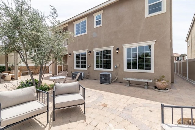 34072 Lily Rd, Yucaipa, CA 92399 - back of house featuring a patio, central AC, and stucco siding