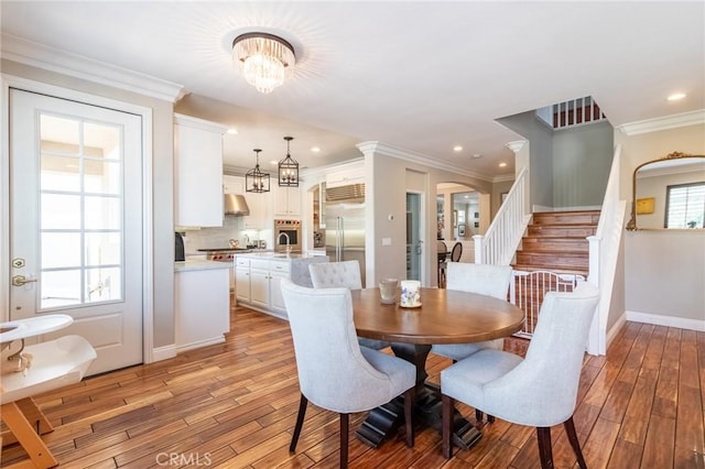 34072 Lily Rd, Yucaipa, CA 92399 - dining room featuring light wood-type flooring, stairway, baseboards, recessed lighting, and ornamental molding