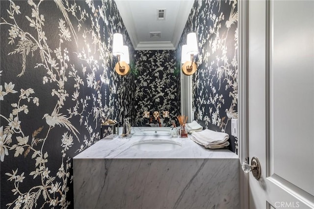 34072 Lily Rd, Yucaipa, CA 92399 - bathroom with wallpapered walls, crown molding, and a sink