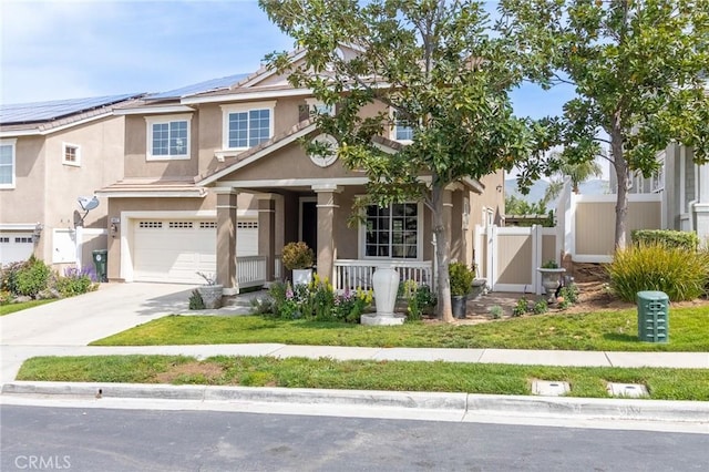 34072 Lily Rd, Yucaipa, CA 92399 - view of front facade featuring covered porch, an attached garage, driveway, fence, and stucco siding