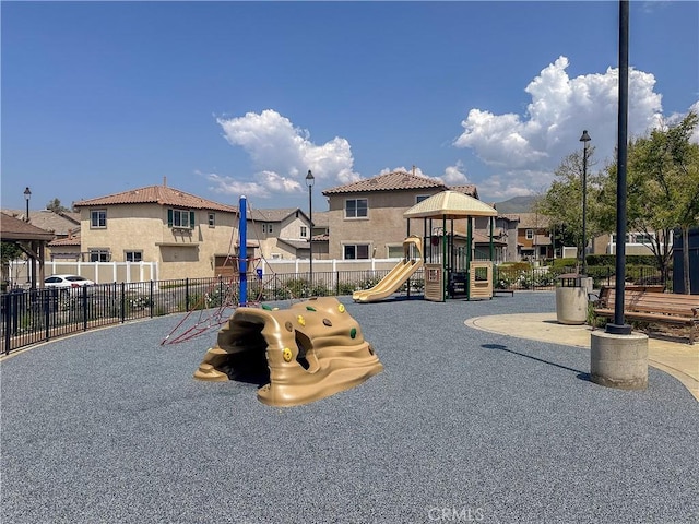 34072 Lily Rd, Yucaipa, CA 92399 - community play area featuring a residential view and fence