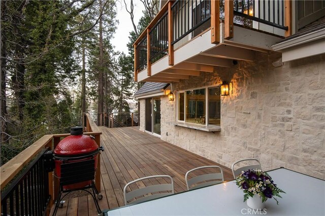 deck featuring outdoor dining area