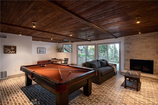 playroom featuring visible vents, wood ceiling, and brick floor