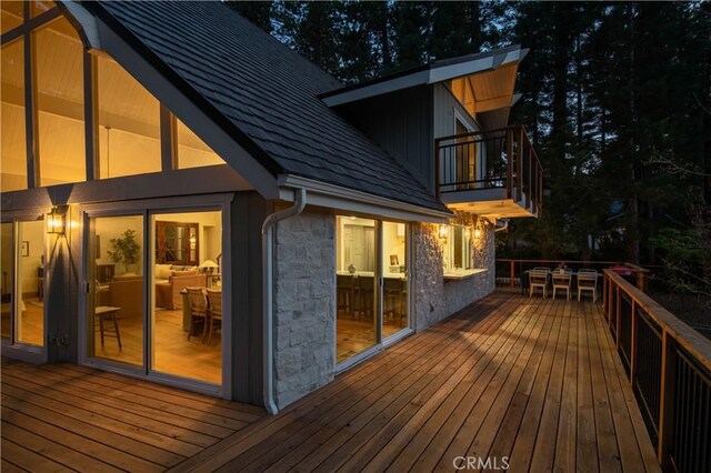 wooden deck with outdoor dining area