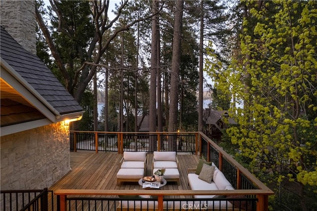 wooden deck featuring an outdoor living space