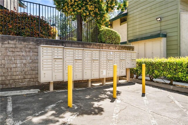 surrounding community with uncovered parking and mail area