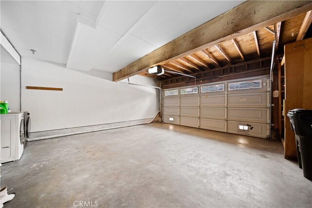 garage with washer and clothes dryer