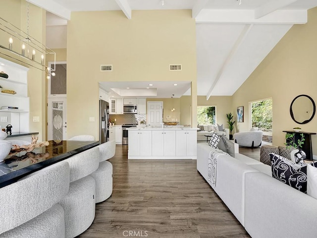 31062 Flying Cloud Dr, Laguna Niguel, CA 92677 - living area with visible vents, beam ceiling, high vaulted ceiling, recessed lighting, and dark wood-type flooring