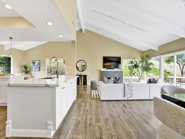 31062 Flying Cloud Dr, Laguna Niguel, CA 92677 - living room featuring light wood-style floors, beamed ceiling, and recessed lighting