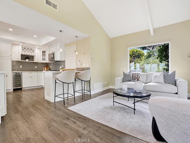 31062 Flying Cloud Dr, Laguna Niguel, CA 92677 - living room with beverage cooler, baseboards, visible vents, and wood finished floors