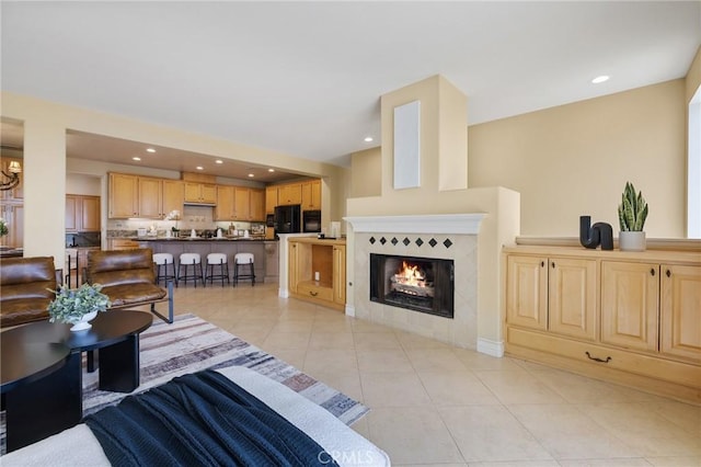 2438 Vista Del Sol Ln, Verne, CA 91750 - living area featuring light tile patterned floors, a fireplace, recessed lighting, and a chandelier