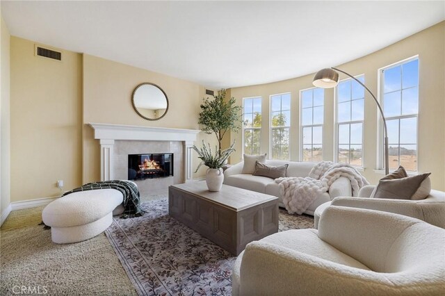 2438 Vista Del Sol Ln, Verne, CA 91750 - living room with a healthy amount of sunlight, baseboards, a tile fireplace, and visible vents