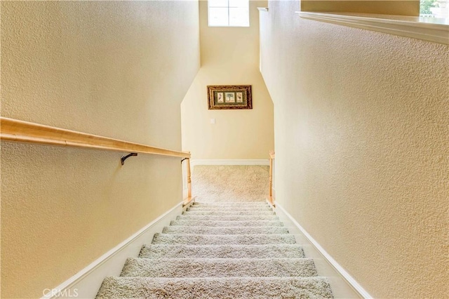 2438 Vista Del Sol Ln, Verne, CA 91750 - stairway with carpet floors, a textured wall, and baseboards