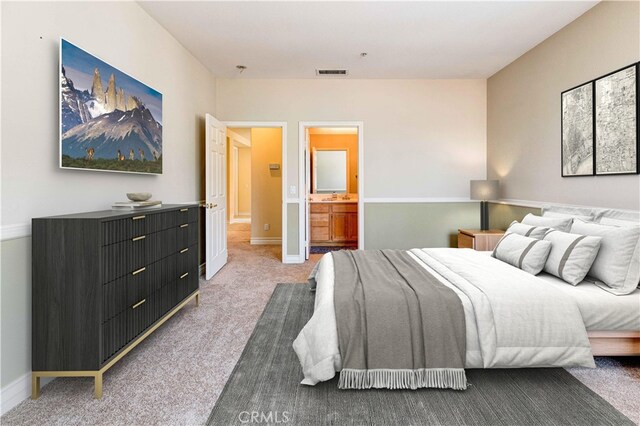 2438 Vista Del Sol Ln, Verne, CA 91750 - bedroom featuring visible vents, baseboards, ensuite bath, and light colored carpet