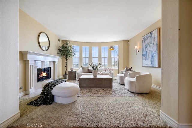 2438 Vista Del Sol Ln, Verne, CA 91750 - living area with a glass covered fireplace, baseboards, and carpet flooring