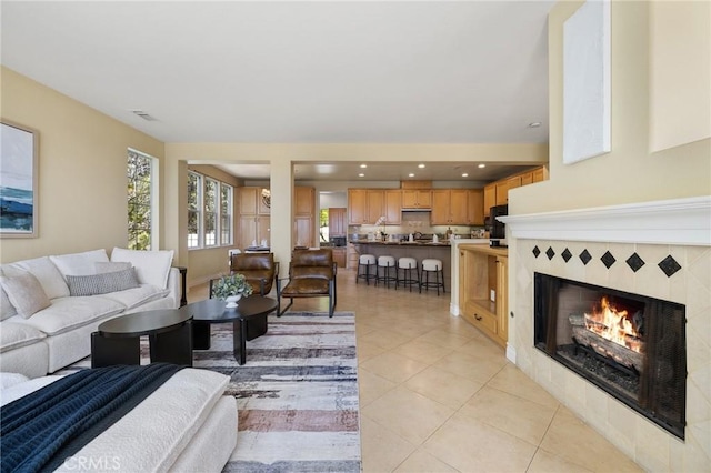 2438 Vista Del Sol Ln, Verne, CA 91750 - living area with visible vents, light tile patterned floors, and a tile fireplace