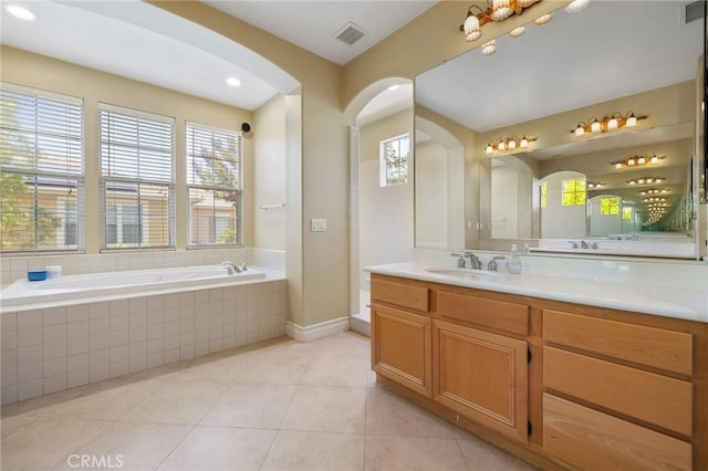 2438 Vista Del Sol Ln, Verne, CA 91750 - full bath featuring visible vents, a garden tub, vanity, baseboards, and tile patterned floors
