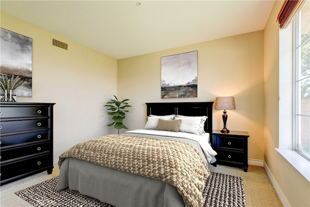 2438 Vista Del Sol Ln, Verne, CA 91750 - bedroom featuring baseboards, multiple windows, light carpet, and visible vents