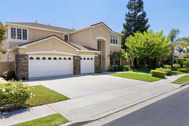 2438 Vista Del Sol Ln, Verne, CA 91750 - traditional-style home with a front yard, stucco siding, an attached garage, driveway, and a tile roof