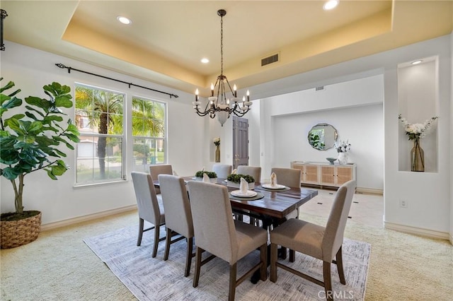 2438 Vista Del Sol Ln, Verne, CA 91750 - dining space featuring visible vents, a raised ceiling, light carpet, and an inviting chandelier