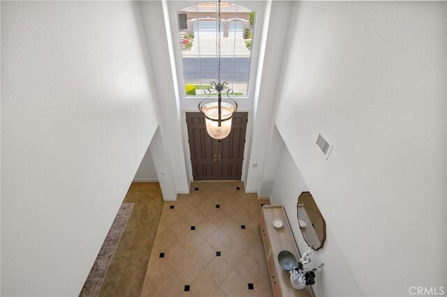 2438 Vista Del Sol Ln, Verne, CA 91750 - foyer entrance with baseboards, a high ceiling, and visible vents
