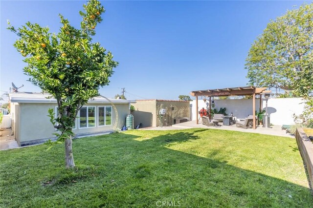 back of property featuring a patio area, fence, an outdoor hangout area, a yard, and a pergola