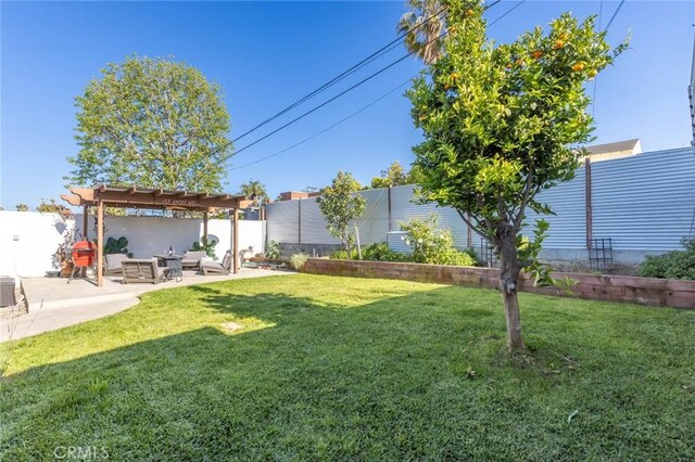 view of yard with a pergola, an outdoor living space, a fenced backyard, and a patio area