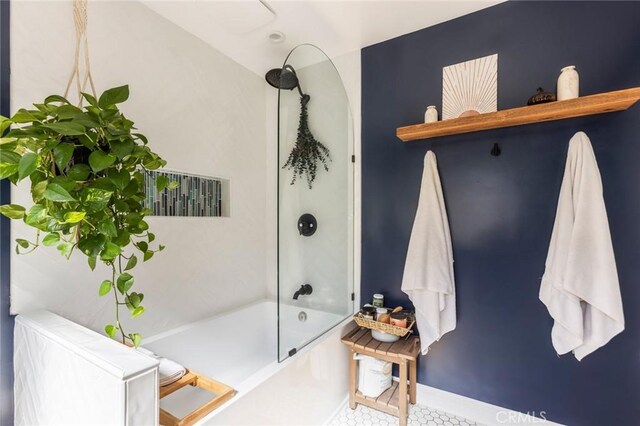 full bath with shower / bathing tub combination and tile patterned flooring