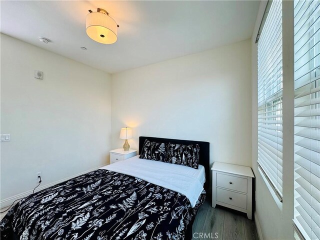bedroom with wood finished floors