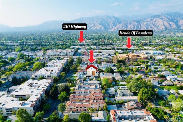 birds eye view of property with a mountain view