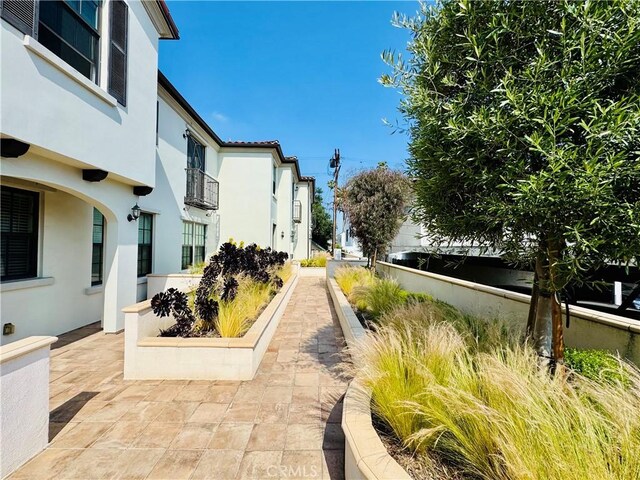 surrounding community featuring a patio area