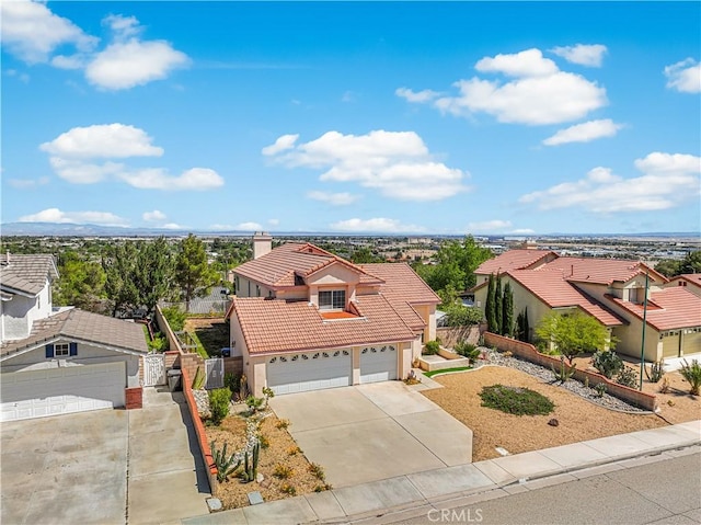 birds eye view of property with a residential view