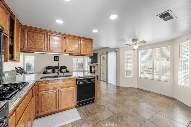 kitchen with ceiling fan, visible vents, dishwasher, a sink, and stainless steel gas stovetop