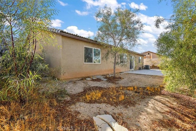905 Broadway Ave, Barstow, CA 92311 - rear view of house with fence, a patio, and stucco siding