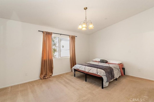 905 Broadway Ave, Barstow, CA 92311 - bedroom featuring baseboards, a notable chandelier, and light carpet