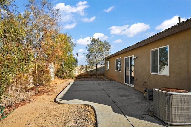905 Broadway Ave, Barstow, CA 92311 - view of property exterior with cooling unit, a patio area, and stucco siding