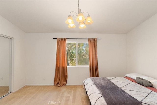 905 Broadway Ave, Barstow, CA 92311 - bedroom with baseboards, an inviting chandelier, and light carpet