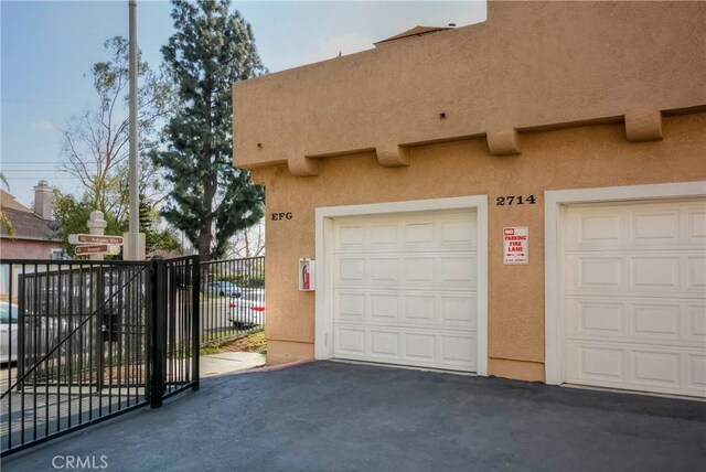garage with fence