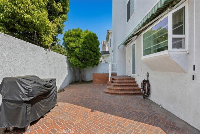 view of patio / terrace featuring fence and area for grilling