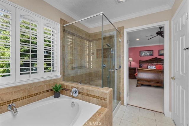 ensuite bathroom featuring connected bathroom, tile patterned floors, a ceiling fan, a shower stall, and a wealth of natural light