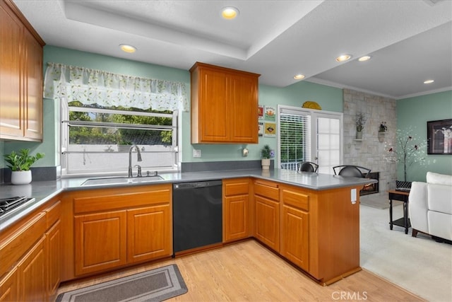 kitchen featuring a sink, dishwasher, light wood-style flooring, a peninsula, and open floor plan