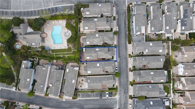 birds eye view of property with a residential view